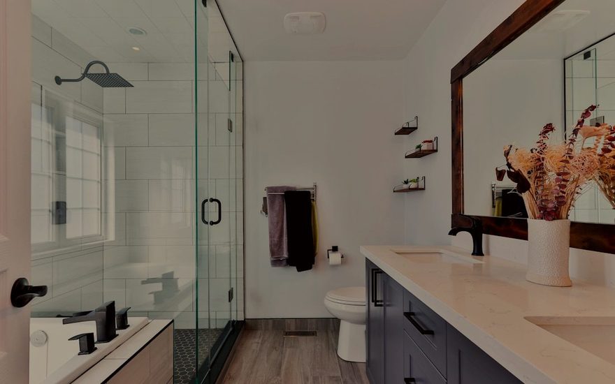 Bright renovated bathroom with custom tile and a floating vanity