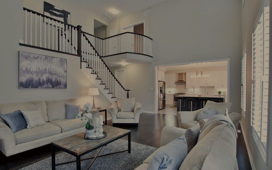 Open-concept renovated home interior with warm wood floors